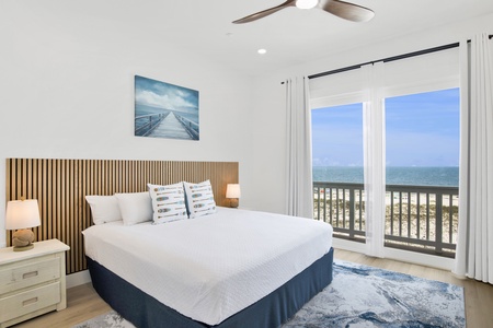 Bedroom 2 offers a King bed, balcony access and private bathroom