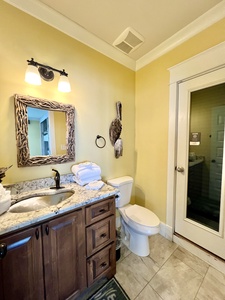 The hallway bathroom features a shower that can be enjoyed open-air or closed in for privacy