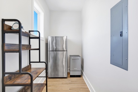 Second refrigerator and ice maker on the 1st floor behind the kitchen