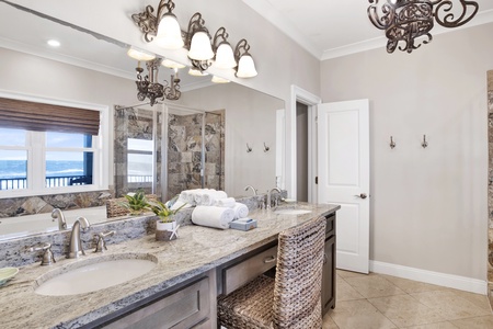 The private Master bath has a double vanity and a walk-in shower