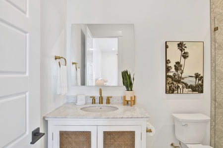 The private bathroom has a single vanity