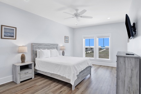 Summertime Blues II- Bedroom 3 on the 2nd floor with a queen bed, Gulf views, ceiling fan, TV and a private bathroom