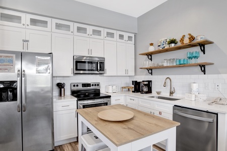 Fully equipped kitchen with stainless appliances