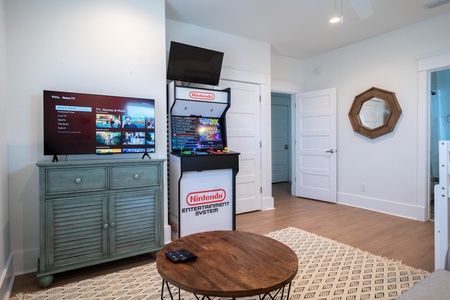 Bedroom #8 comes with a new arcade machine, television and a private bathroom