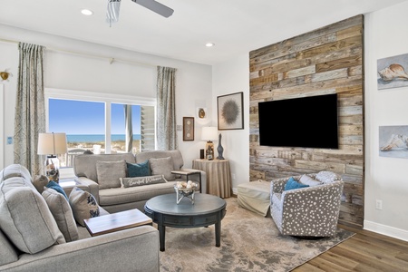 The living room features views of the Gulf and a TV