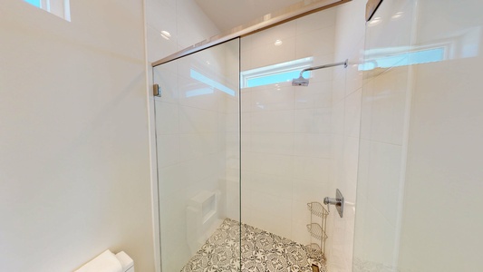 The private bathroom in Bedroom 6 has a large walk-in shower