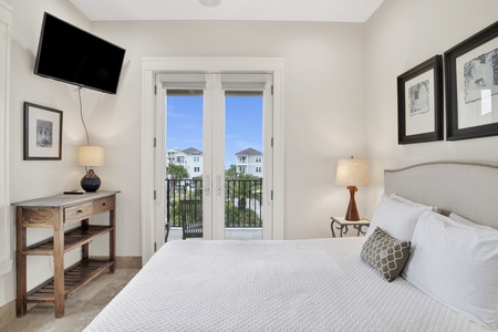 Bedroom 4- 2nd floor has a queen bed, TV, balcony access and a private bath