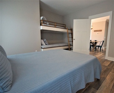 Bedroom 2, queen bed, 2 twin bunks, sleeps 4, TV, attached bath