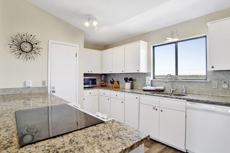 Granite countertops and all of the large and small appliances needed to prepare meals