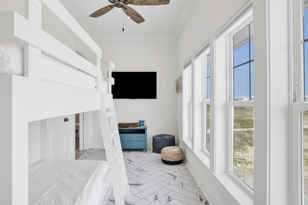 Bedroom 3(bunkroom) comes with a TV and a barn door for privacy