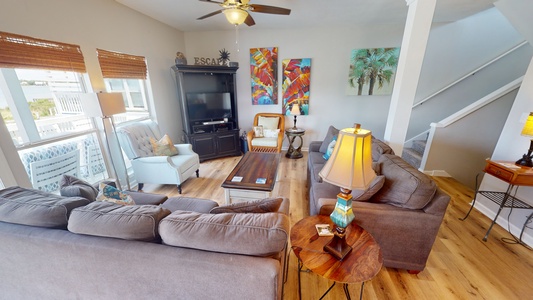 Comfortable seating in this open floor plan and beautiful floors throughout the home