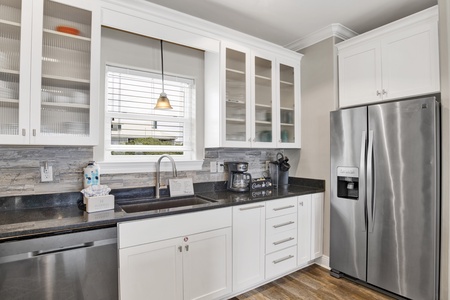 Offering stainless steel appliances and stone counters