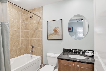 The private bathroom features a tub/shower combo