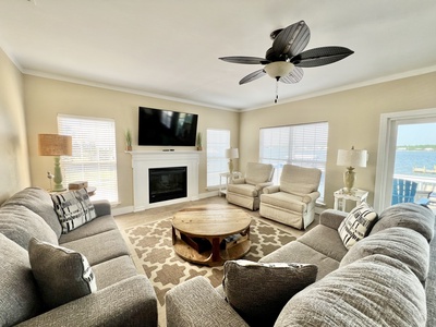 Living room has balcony access with views of the Little Lagoon