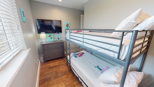 Bedroom 8 will sleep up to 4 guests in 2 twin size bunk beds and has a TV