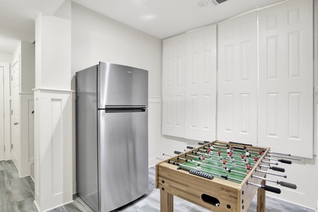 Extra fridge and foosball table