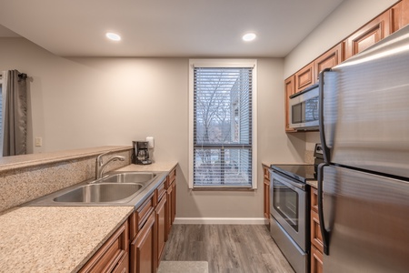 Fully equipped kitchen with stainless steel appliances