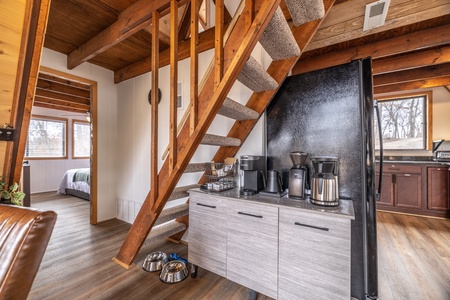 Set between the kitchen and the living area is a fully equi[ped coffee bar!