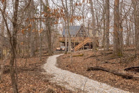 The path to Limerick Lake passes by the hot tub patio and through the woods.