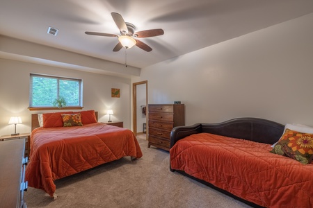 Bedroom 4 with one queen bed and a pull-out trundle with two twin beds