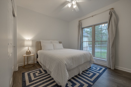 The second guest bedroom contains one queen bed and luxury linens for ultimate comfort