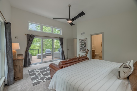 Bedroom 1 - 1 king sized bed, private bathroom, and sliding glass doors to the deck