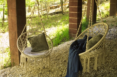 Hanging chairs are a great way to enjoy the space.