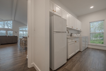 Need room for extra beverages or food? The utility room boasts a second refrigerator and a washer and dryer available for use