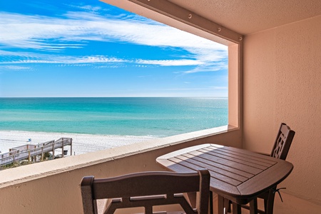 Enjoy your morning coffee at this intimate table while soaking in breathtaking turquoise waters and pristine white sand stretching endlessly before you.