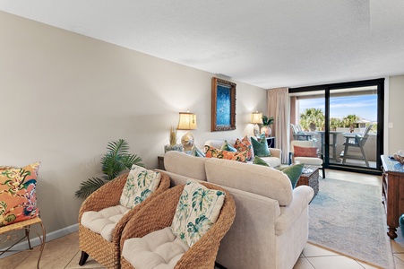 Settle into your coastal-inspired living space, where soft linens, tropical accents, and calming tones create your perfect retreat. Step through the glass doors to your private balcony and soak in sunshine.