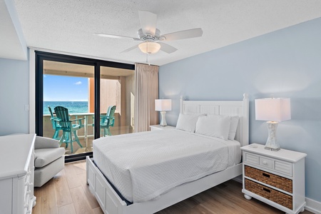 Wake up to stunning ocean views from your private balcony. The serene coastal palette and crisp white linens create your perfect seaside retreat.