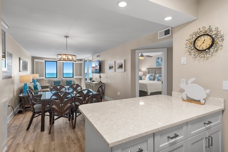 Enjoy your morning coffee at the pristine kitchen island while ocean waves sparkle beyond your windows—beachfront living at its finest.