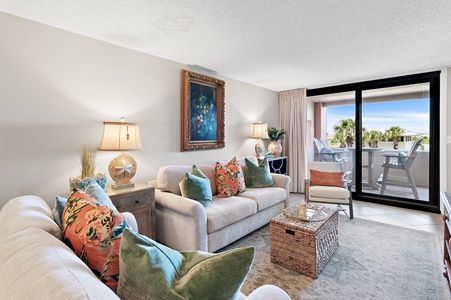 Settle into your coastal retreat, where plush seating and pops of color set the tone for relaxation. Step onto your private balcony for ocean breezes and palm-lined views.