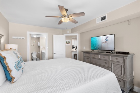 Relax in your spacious bedroom with a ceiling fan keeping you cool, flat-screen TV for entertainment, and en-suite bathroom for convenience.
