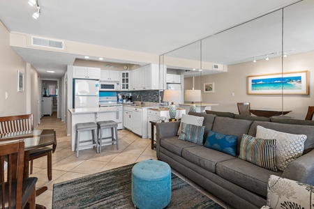 Your bright open-plan space flows seamlessly from kitchen to living room, where you'll love the coastal touches and modern comfort.