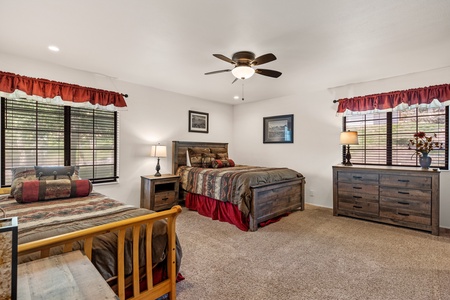 Downstairs bedroom with queen, twin, and trundle beds