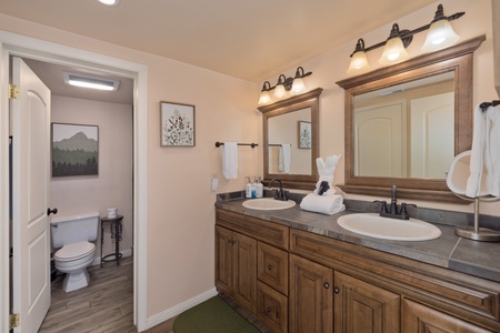 Freshen up in your private bathroom with dual sinks, abundant counter space, and soft lighting that makes morning routines feel effortless and serene.