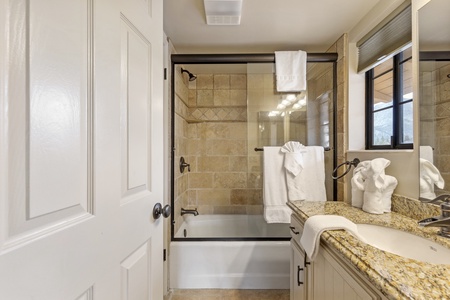 Bathroom attached to bedroom and hallway