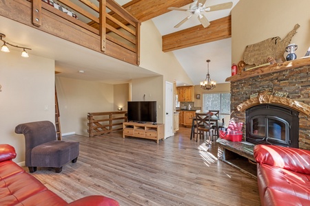 Wood burning fireplace and TV in living area