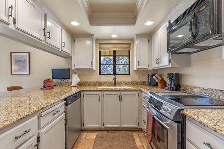 Fully stocked kitchen with range and dishwasher