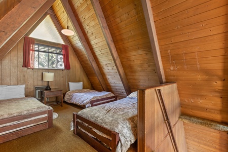 Loft with three single beds