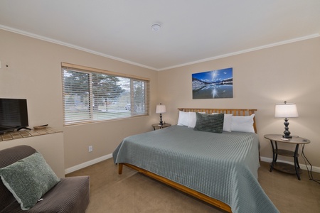 Settle into your peaceful retreat with a comfy bed, soft linens, and natural light. Your TV awaits cozy evenings, while bedside lamps create the perfect ambiance for unwinding.