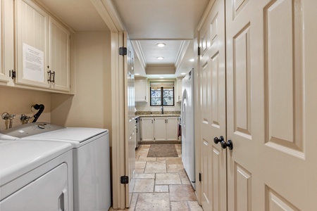 Laundry closet on the left