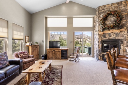 Living area with TV and woodburning fireplace