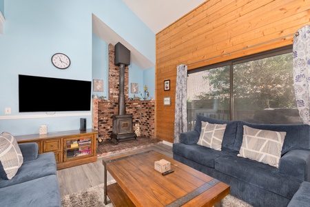 Living room with wood burning fireplace.