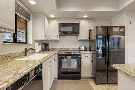 Fully stocked kitchen with range and dishwasher