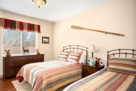 Third downstairs bedroom with queen and twin beds