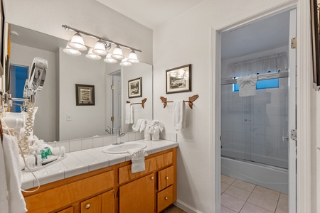 Bathroom attached to second level room shared with living area