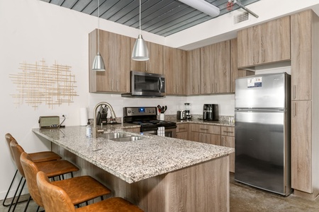 Prepare delicious meals in this modern kitchen with all the essentials.