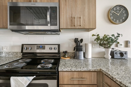 Prepare delicious meals in this modern kitchen with all the essentials.